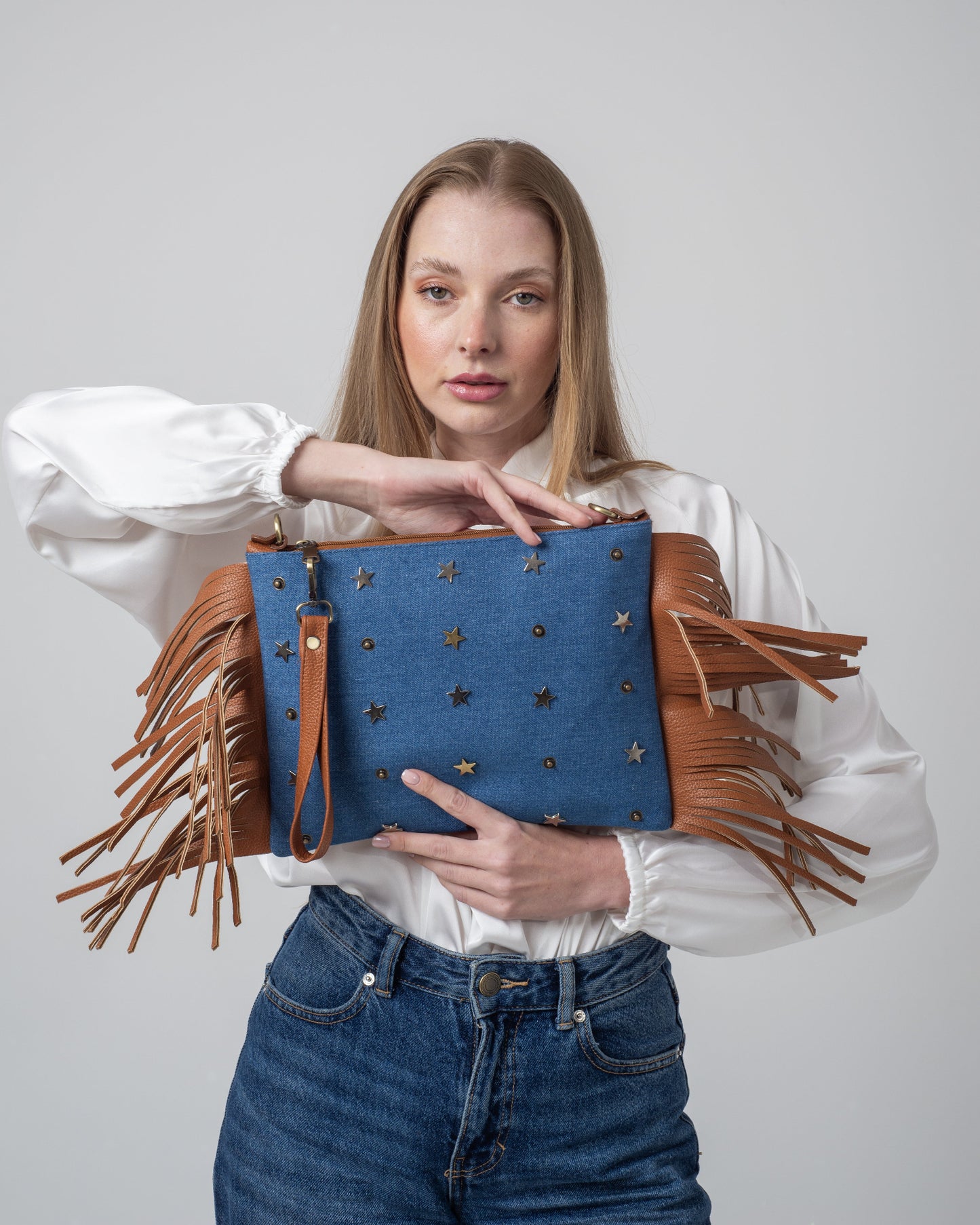 studded light blue-denim stars clutch