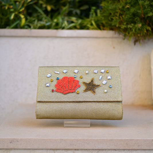 Shell embroidered clutch