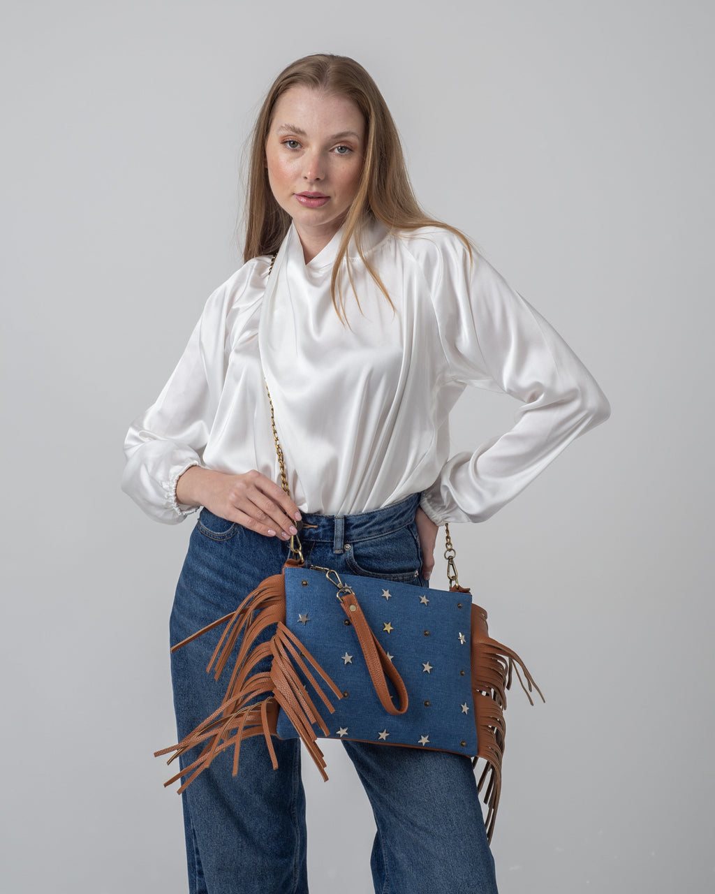 studded light blue-denim stars clutch